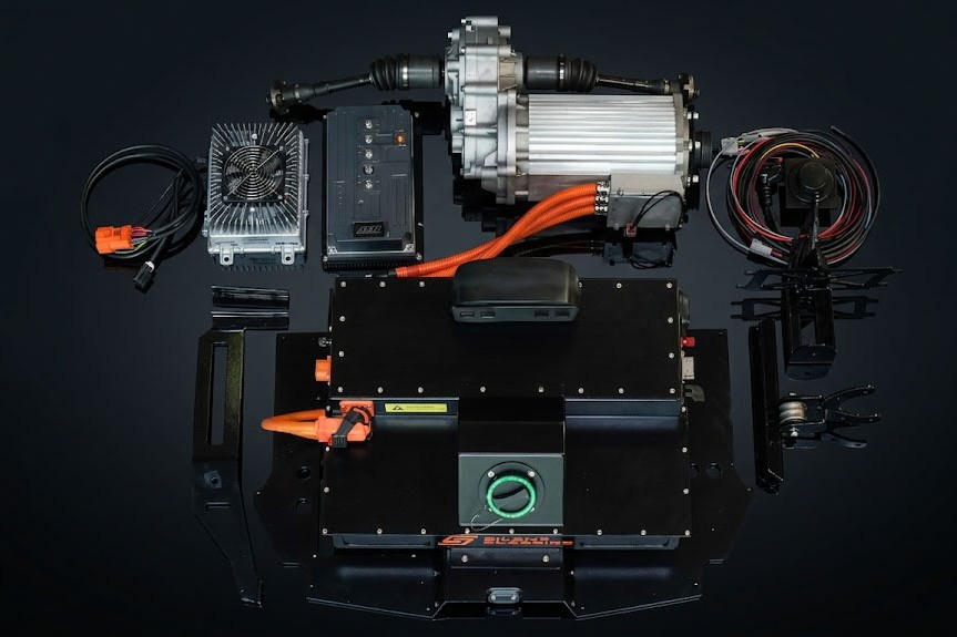 The Silent Classics V2 conversion kit — motor, inverter, battery pack, harness and ancillaries laid out.