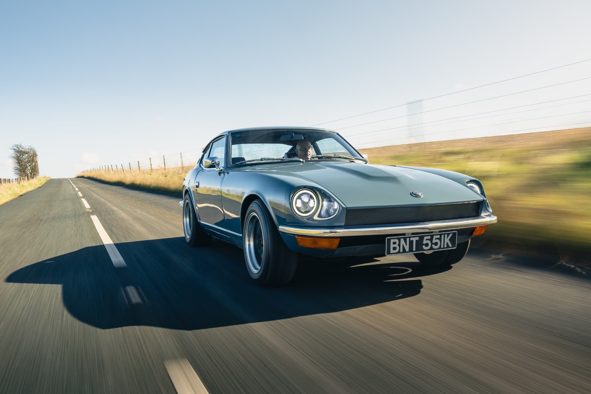 Silent Classics electric Datsun 240Z driving on an open country road