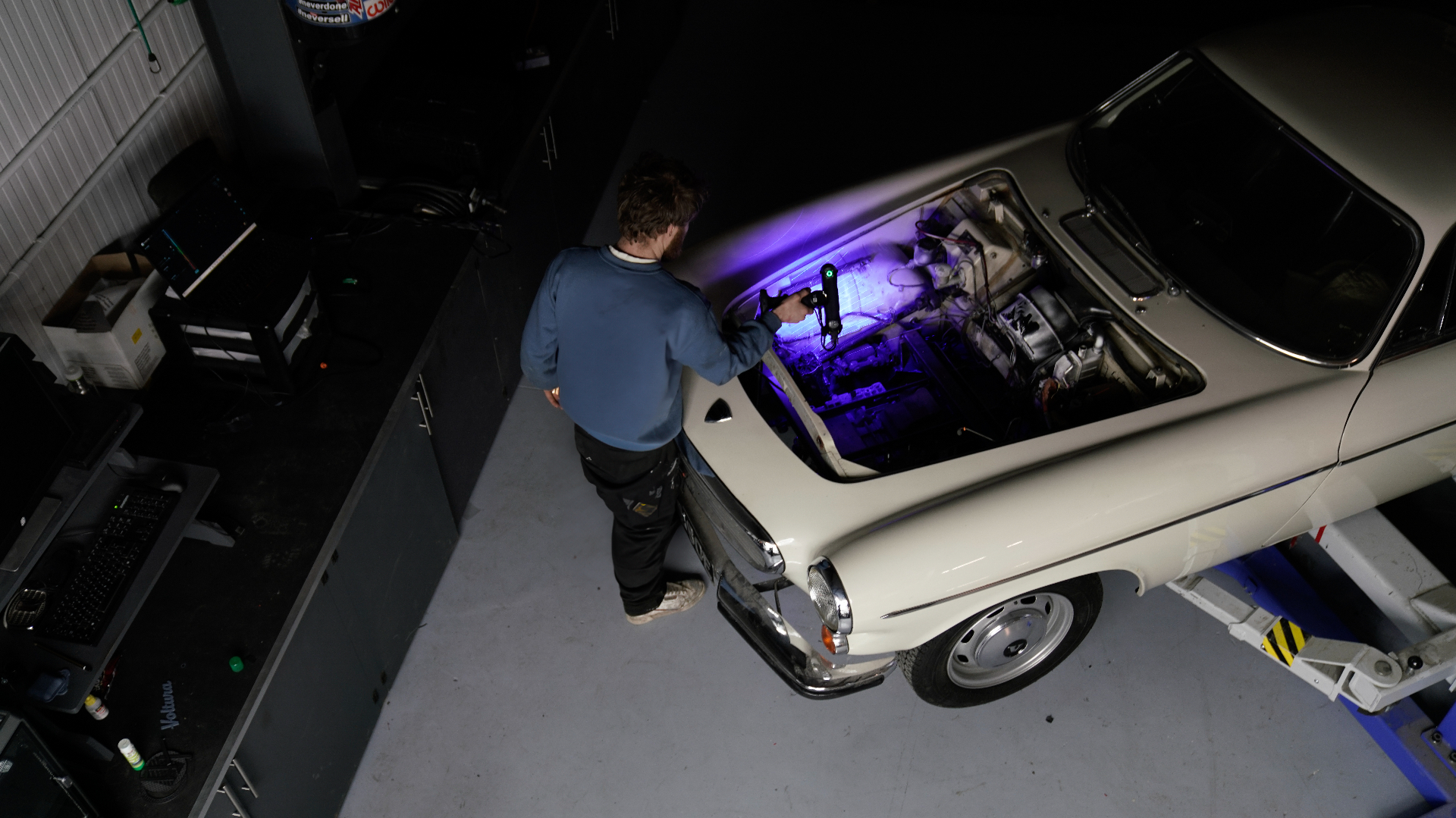 Engineer 3D-scanning a classic Fiat 500 engine bay at the Silent Classics workshop